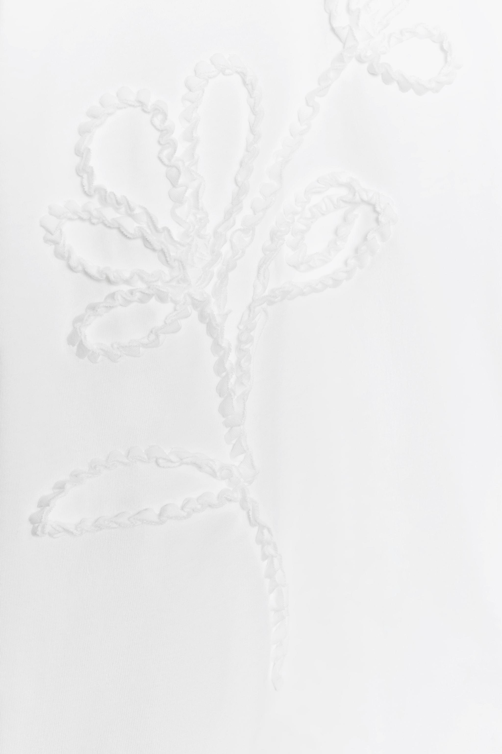 T-SHIRT FLEUR EN RELIEF